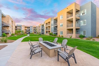 Outdoor lounge area with fire pit and entertaining space